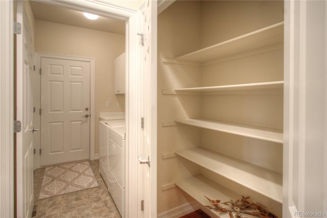 8594 W Quarto Ave, Littleton, CO 80128 - laundry room featuring washing machine and clothes dryer and cabinet space