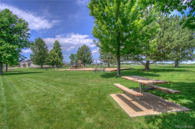 8594 W Quarto Ave, Littleton, CO 80128 - surrounding community with a lawn