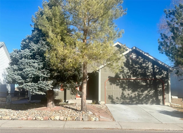 obstructed view of property featuring a garage