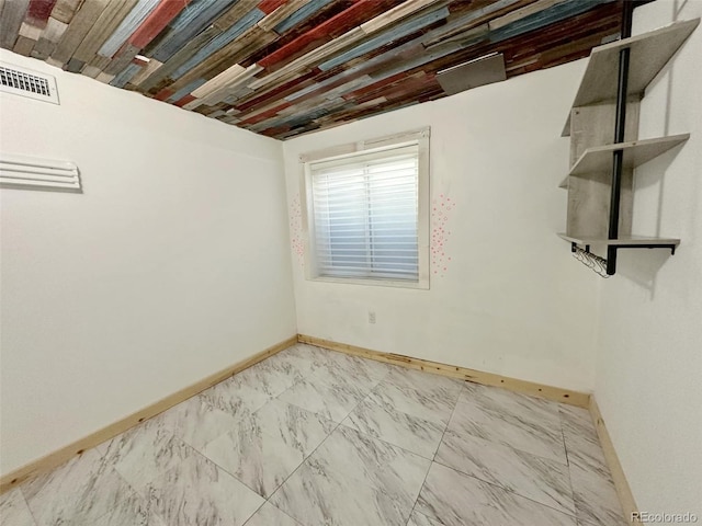 empty room with wooden ceiling