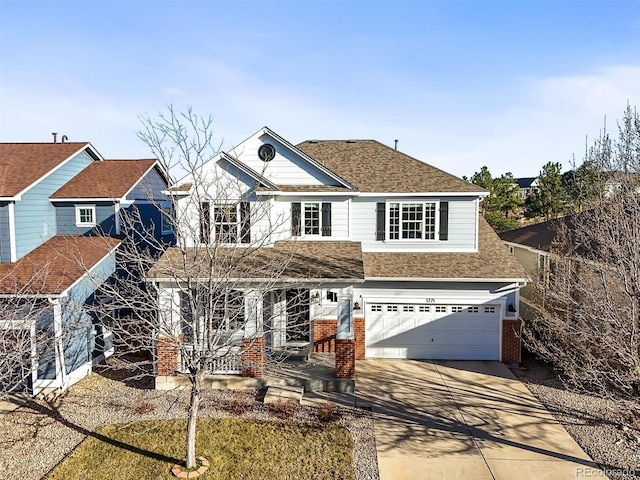 view of front of home with driveway, roof with shingles, an attached garage, covered porch, and brick siding