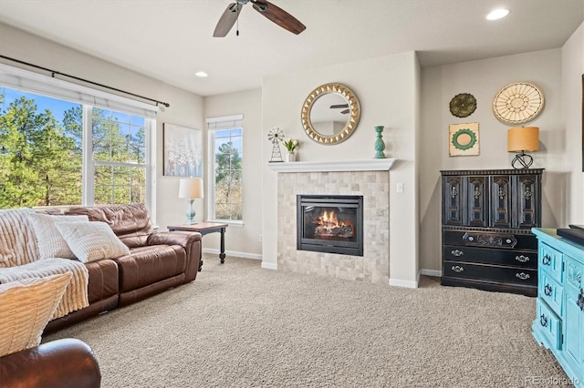 living room with carpet, ceiling fan, a tile fireplace, baseboards, and recessed lighting