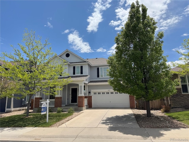 1271 Sky Rock Way, Castle Rock, CO 80109 - view of front of house featuring brick siding, a garage, concrete driveway, and a shingled roof