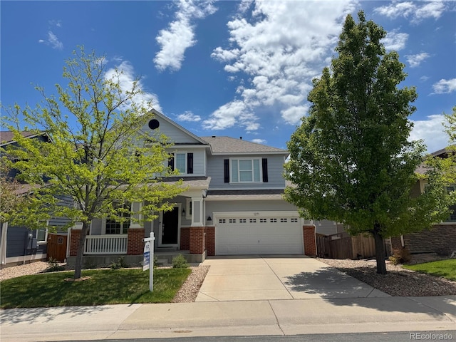 1271 Sky Rock Way, Castle Rock, CO 80109 - craftsman house featuring brick siding, concrete driveway, an attached garage, and roof with shingles