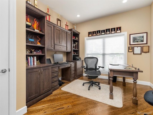 office with recessed lighting, wood finished floors, and baseboards