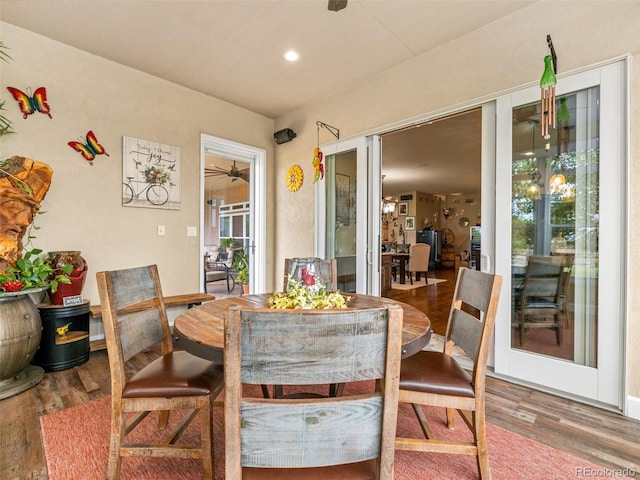 dining space with recessed lighting, wood finished floors, and a ceiling fan