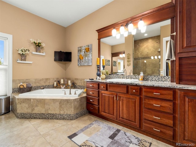 full bathroom with tile patterned flooring, a garden tub, vanity, and a tile shower