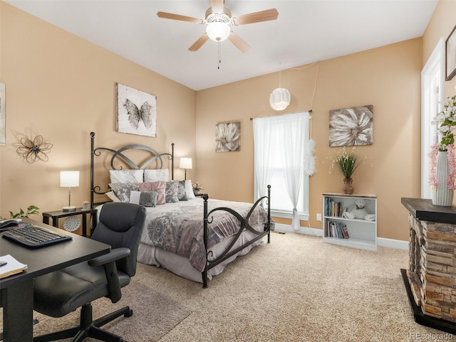 bedroom featuring carpet, baseboards, and ceiling fan