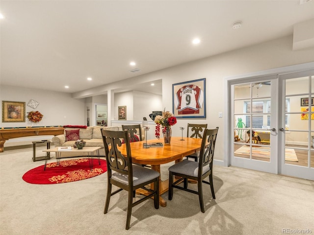 dining space featuring recessed lighting, visible vents, french doors, and light carpet