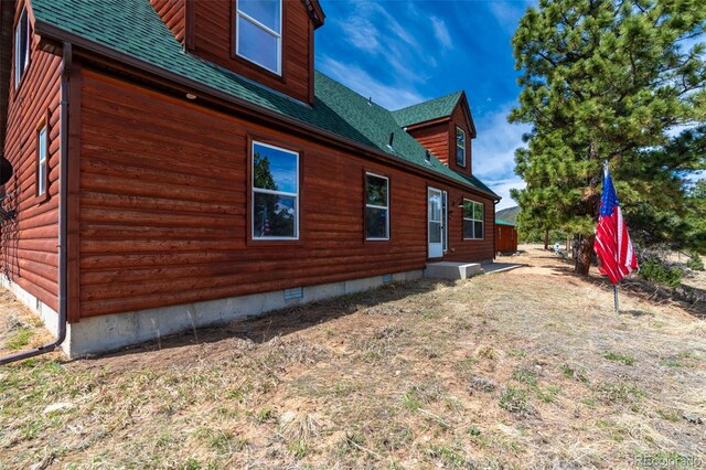 1136 Bird Point Dr, Cotopaxi, CO 81223 - view of side of home featuring crawl space, a shingled roof, and log veneer siding