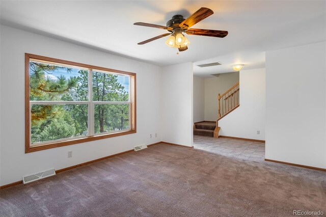 1136 Bird Point Dr, Cotopaxi, CO 81223 - carpeted spare room featuring ceiling fan, visible vents, and stairway