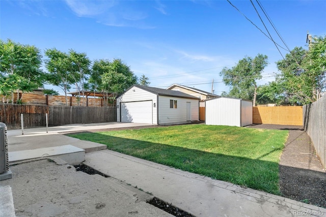 5640 Niagara St, Commerce City, CO 80022 - fenced backyard featuring an outdoor structure and a detached garage
