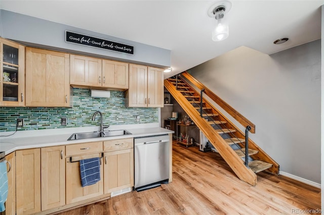 1150 Inca St Unit 43, Denver, CO 80204 - kitchen featuring light brown cabinets, stainless steel dishwasher, and a sink