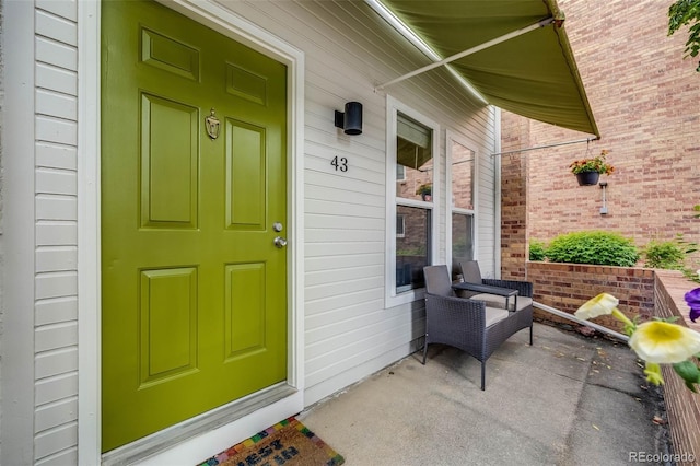1150 Inca St Unit 43, Denver, CO 80204 - doorway to property featuring a porch