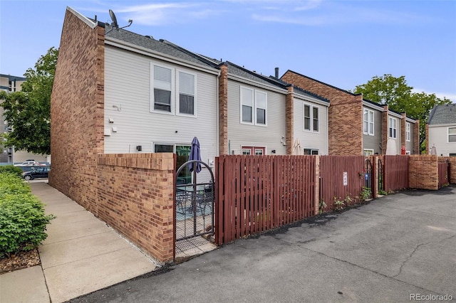 1150 Inca St Unit 43, Denver, CO 80204 - view of property exterior with a gate