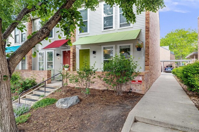 1150 Inca St Unit 43, Denver, CO 80204 - view of front facade with brick siding