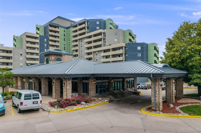 1150 Inca St Unit 43, Denver, CO 80204 - view of building exterior featuring uncovered parking