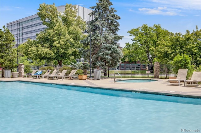 1150 Inca St Unit 43, Denver, CO 80204 - community pool featuring a patio area
