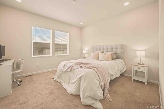 carpeted bedroom with visible vents, baseboards, and recessed lighting