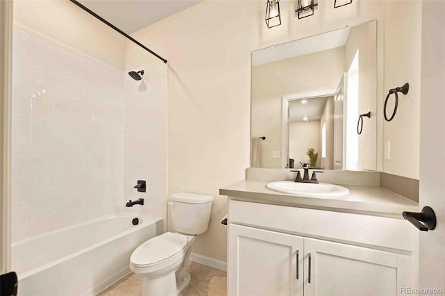 bathroom featuring toilet,  shower combination, tile patterned floors, baseboards, and vanity