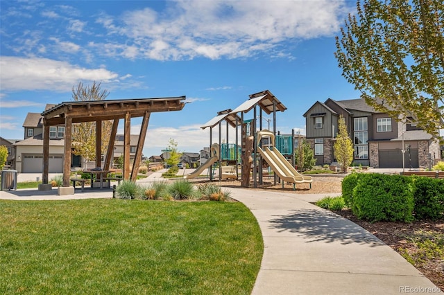 community jungle gym with a yard and a residential view