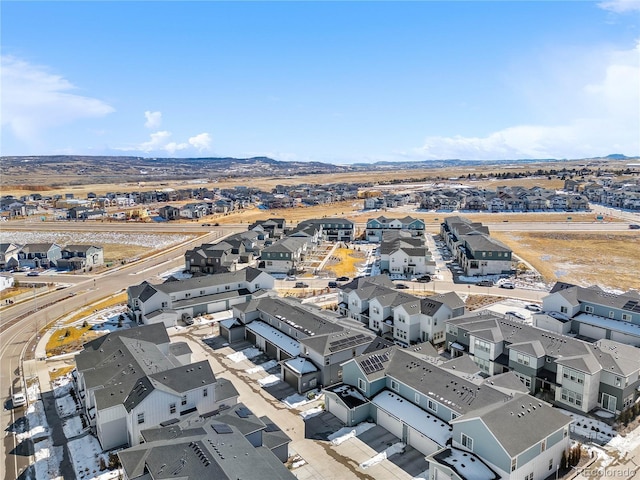 birds eye view of property featuring a mountain view and a residential view