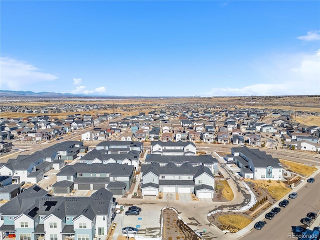 drone / aerial view featuring a mountain view and a residential view