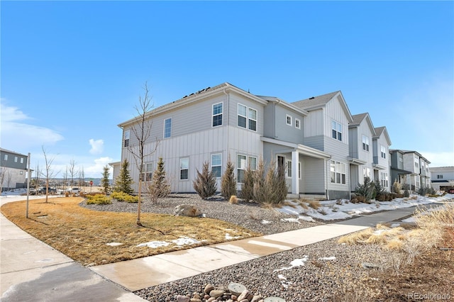 view of front of home featuring a residential view and board and batten siding