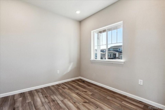 unfurnished room featuring wood-type flooring