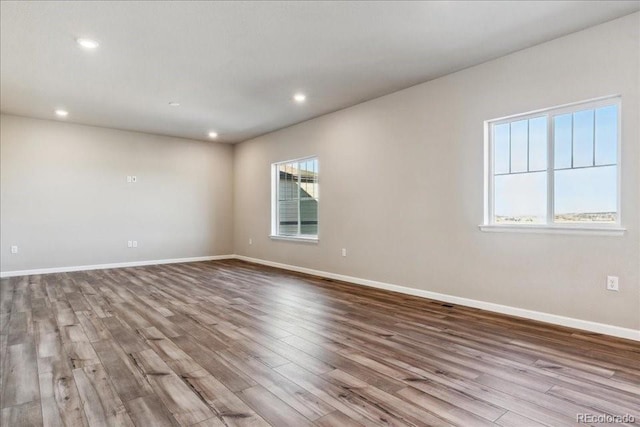 spare room with light hardwood / wood-style floors