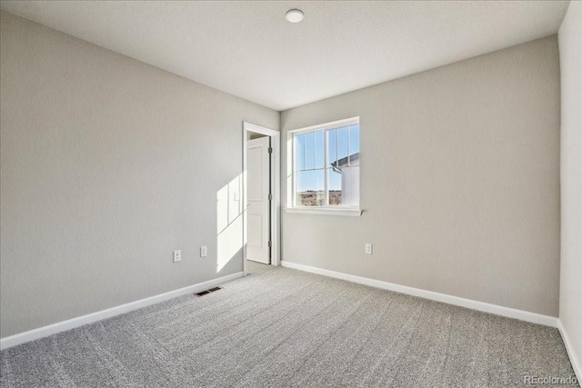 empty room with carpet flooring