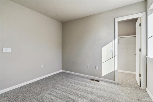 unfurnished bedroom with light colored carpet