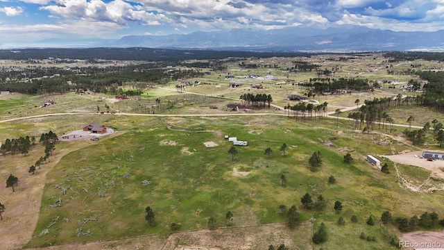 bird's eye view featuring a mountain view and a rural view