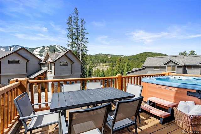 200 Antler Way, Winter Park, CO 80482 - wooden deck featuring a hot tub, a mountain view, and outdoor dining area