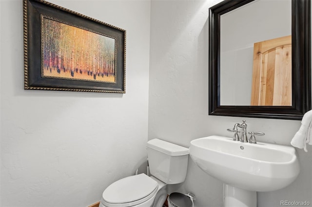 200 Antler Way, Winter Park, CO 80482 - bathroom with toilet, a sink, and a textured wall