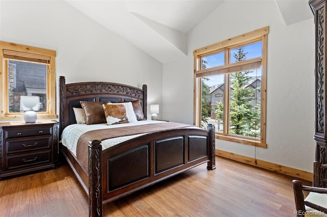 200 Antler Way, Winter Park, CO 80482 - bedroom featuring lofted ceiling, multiple windows, light wood-type flooring, and baseboards