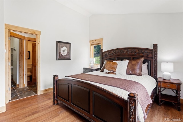 200 Antler Way, Winter Park, CO 80482 - bedroom featuring high vaulted ceiling, baseboards, light wood-style flooring, and ensuite bathroom