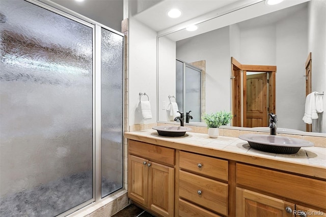 200 Antler Way, Winter Park, CO 80482 - full bathroom featuring a stall shower, double vanity, and tile patterned floors
