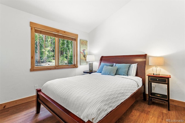 200 Antler Way, Winter Park, CO 80482 - bedroom with wood finished floors, lofted ceiling, and baseboards