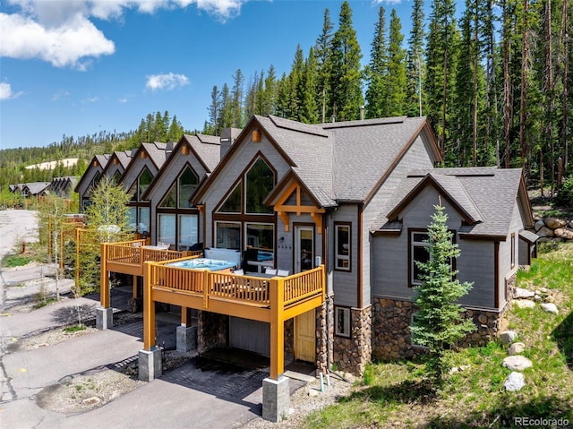 200 Antler Way, Winter Park, CO 80482 - view of front of property with roof with shingles, stone siding, and a wooden deck