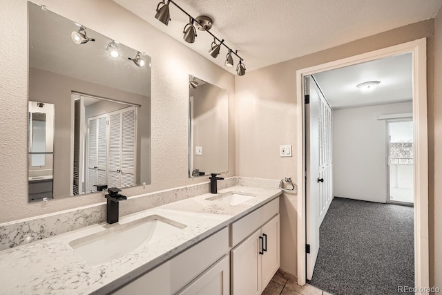 bathroom featuring vanity and a textured ceiling