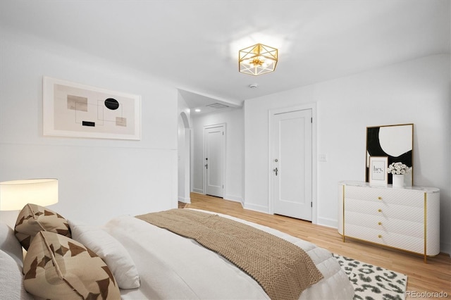 bedroom with hardwood / wood-style floors