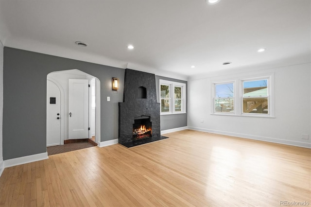 unfurnished living room with light hardwood / wood-style floors