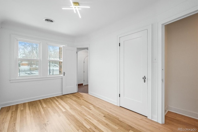 unfurnished bedroom featuring light wood-type flooring