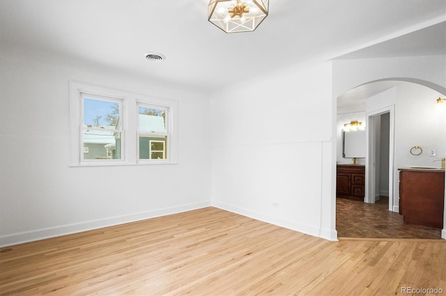 unfurnished room featuring light wood-type flooring