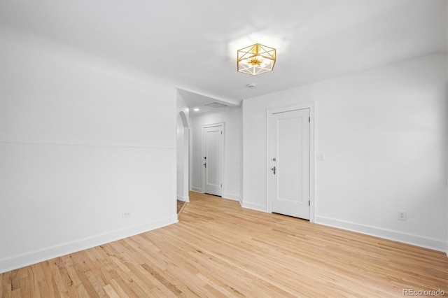 unfurnished room with light hardwood / wood-style flooring