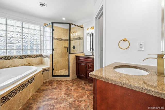 bathroom with plus walk in shower and vanity