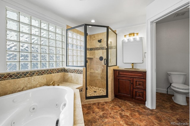 full bathroom featuring vanity, separate shower and tub, and toilet