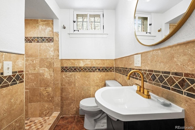 bathroom with walk in shower, tile patterned flooring, tile walls, and toilet