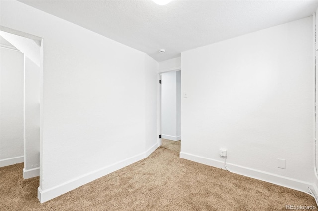 unfurnished room featuring carpet flooring